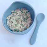 Ham & Pea Risotto in dusty blue baby bowl with a spoon